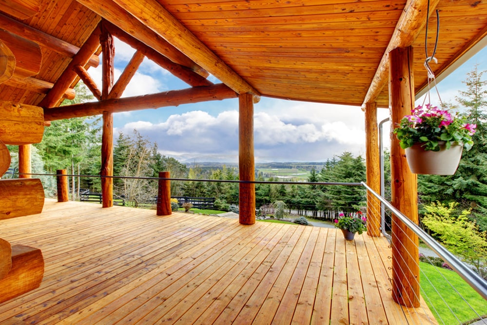 Beautiful view of the log cabin house porch.