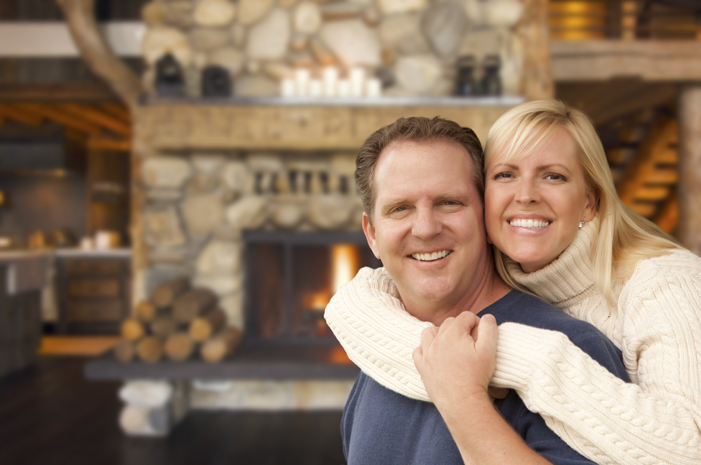 happy couple in log cabin